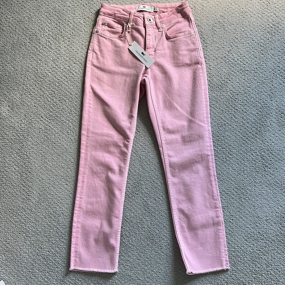 Pink Vineyard Vines jeans with frayed hem.